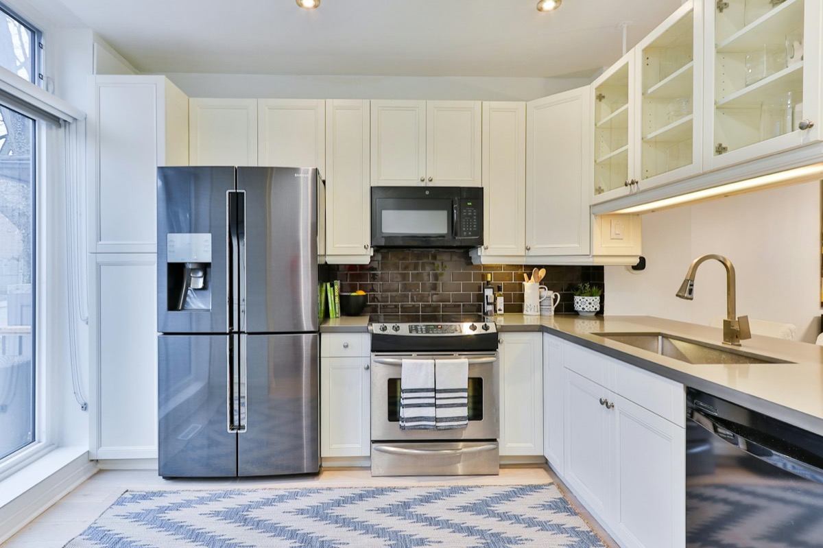Appliance repair in Abilene, TX: home kitchen with refrigerator, range, microwave and dishwasher