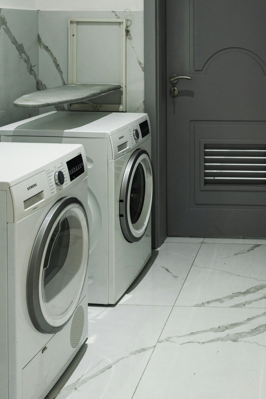 Washer and dryer in a clean home laundry room